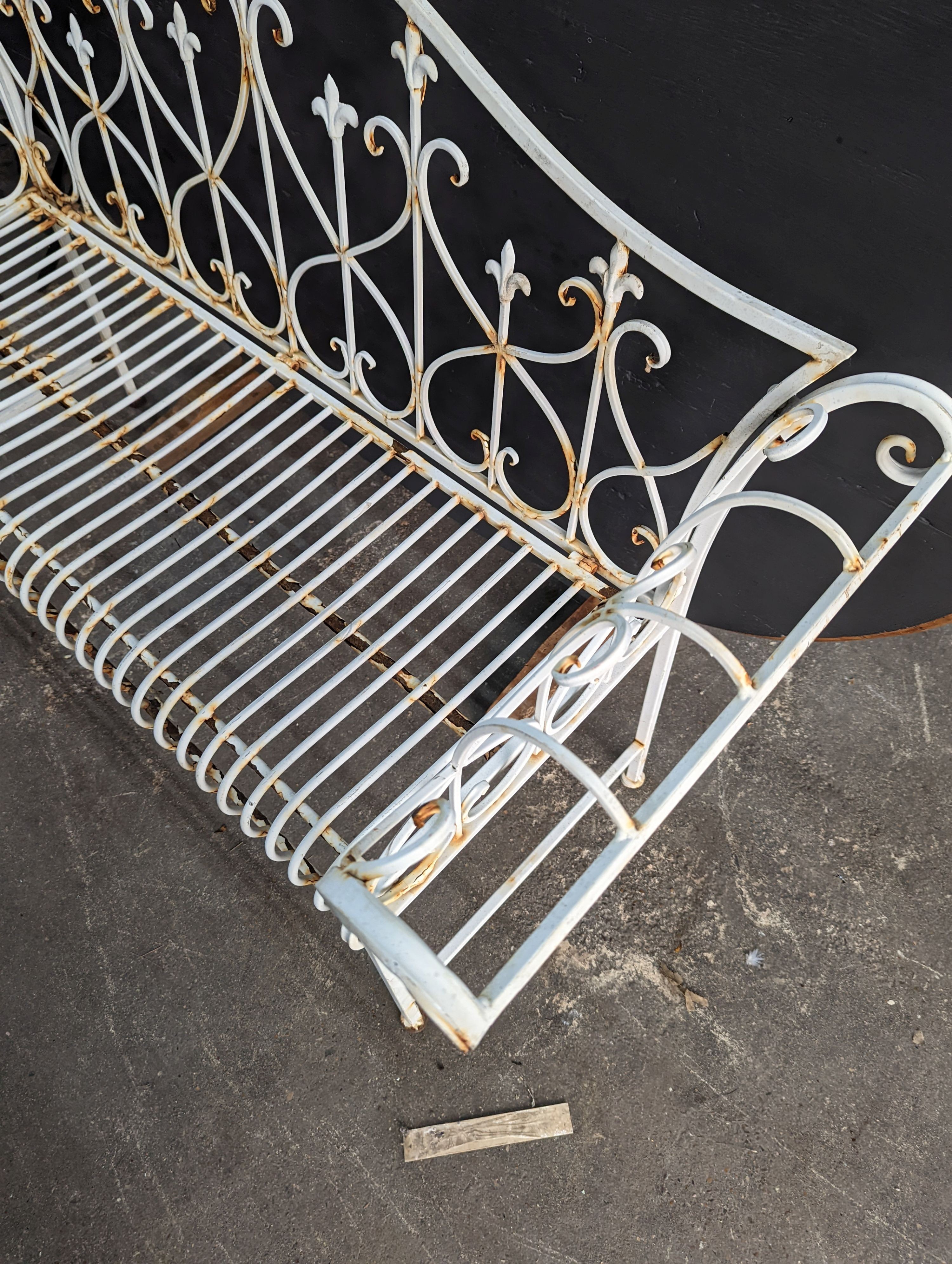 A painted metal folding garden bench, length 148cm, depth 50cm, height 93cm